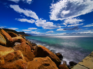 Copper colored rocks with blue sky