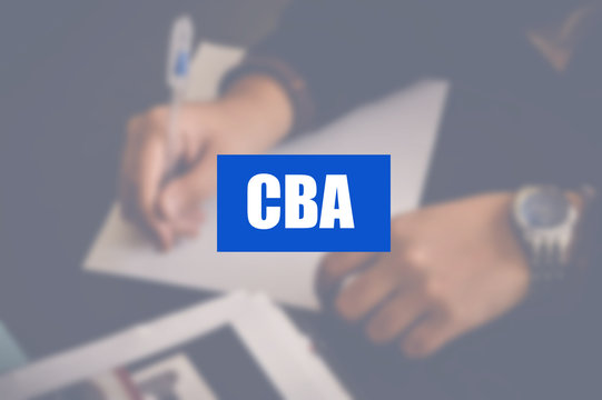 CBA word with business blurring background, cost benefit analysis