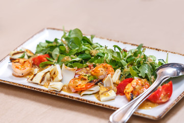 Salad of squid, shrimp, tomatoes and herbs
