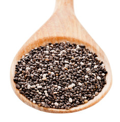Chia seeds in a wooden spoon isolated on a white background. Top view.
