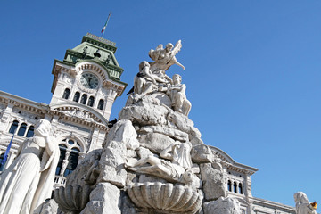 Trieste, Italy.  Main Focus on Four Continent Fountain.   Trieste City Hall in the background.