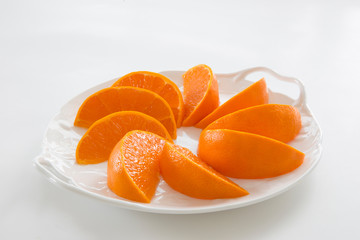 Fototapeta na wymiar Setka, cut fruit, new Japanese variety mandarin orange