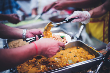 Giving free food to the homeless. Volunteers feed ChiangMai's hungry and homeless meal