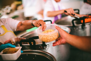 Feeding the poor to hands of a beggar, Poverty concept