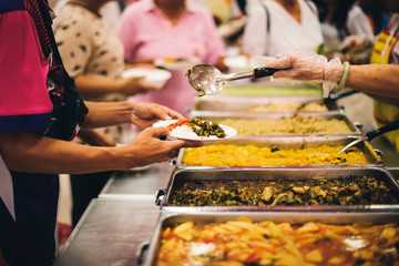 Food support for the poor, homeless hands submitting free food from volunteers