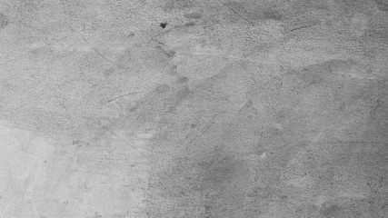 Abstract textured cement concrete gray background and wallpaper. Cracks are rugged, vintage is...