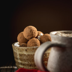 Hot Chocolate Truffles Against a Brown Background