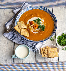 Creamy homemade sweet potato soup on a rustic background