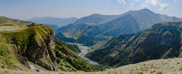 Fototapeta na wymiar Beautiful panorama view to sunny mountains in Georgia 