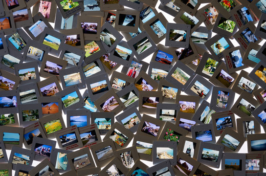 Top view of collection of film slide snapshot pictures on a light table