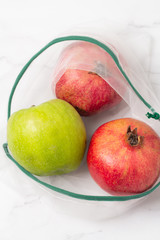 fresh organic fruits and vegetables in a white eco bag top view