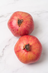 fresh organic red pomegranate on a white background close-up