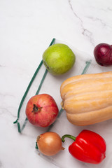 vegetables and fruits in an eco bag on a white background