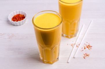 Yellow smoothie in glass