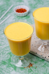 Yellow smoothie in glass
