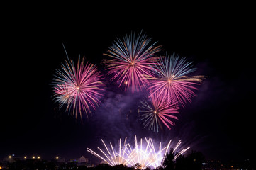 Abstract and brightly colorful firework in the celebration and anniversary festival.Merry Christmas and New year party light over night sky.