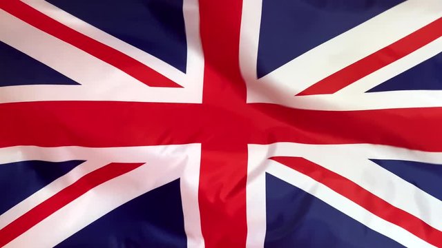 UK flag waving in the wind. British flag close up.
