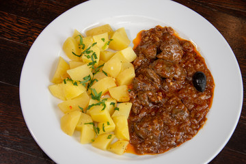 Liver with onion sauce and Pork chop with nature potatoes