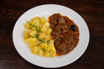 Liver with onion sauce and Pork chop with nature potatoes
