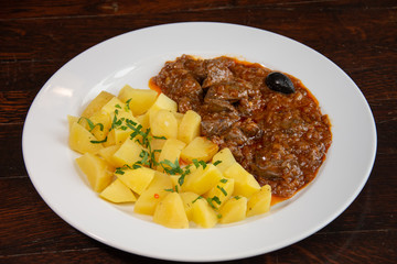 Liver with onion sauce and Pork chop with nature potatoes