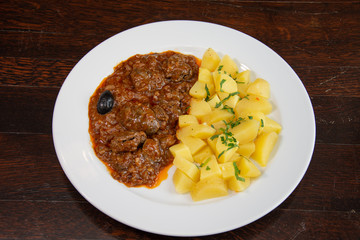 Liver with onion sauce and Pork chop with nature potatoes