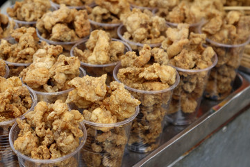 Fried crispy chicken skin and intestine sold as street food in the Philippines