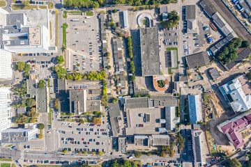 Aerial top down view on industrial district. Top down view on roofs of plants, warehouses and manufacturing companies