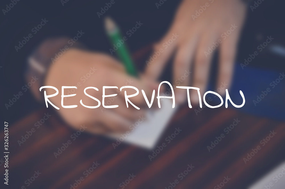 Wall mural Reservation word with business blurring background