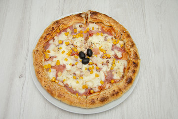 Pizza with corn and ham and sesame