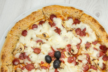 Pizza four friends, with olives and cheese