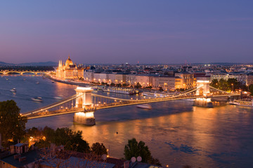 Fototapeta na wymiar Night panorama of Hungarian Parliament Building, Széchenyi Chain Bridge, and River Danube in Budapest, Hungary