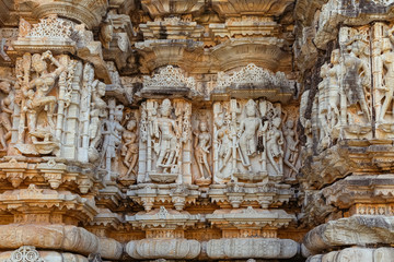 Indian stone artwork and sculptures on the walls of a ancient Jain temple at Chittorgarh Fort Rajasthan