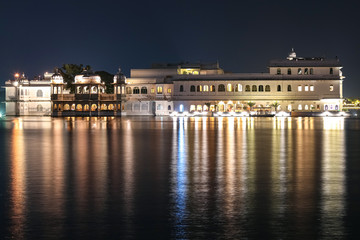 Palace architecture on lake Pichola at night with water reflection at Udaipur rajasthan