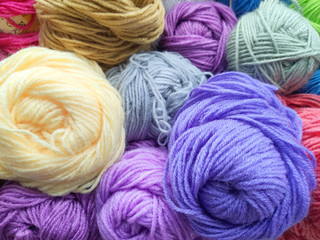 Multicolored Threads colorful Background woolen skeins close-up.