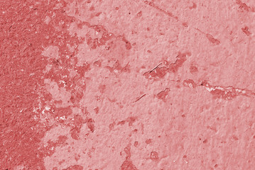 Old asphalt surface close up. Abstract background red color toned