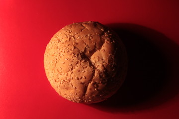 burger roll on a red background