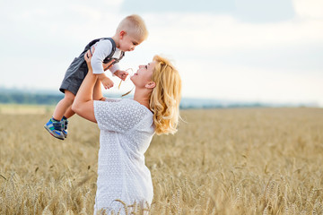 young woman and boy in a wheat field