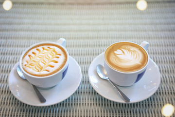 hot caramel macchiato and latte coffee drink put on table in cafe