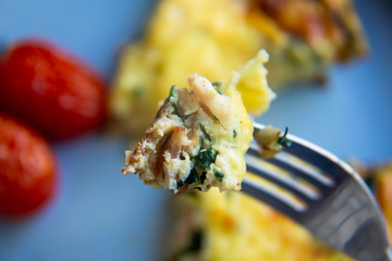 Frittata made of eggs, bacon, cheese and spinach