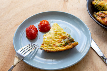Frittata made of eggs, bacon, cheese and spinach