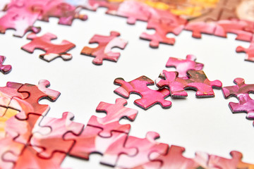 Pieces of a puzzle. Toy. Closeup, selective focus