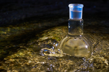 Glass flask with clear water.
