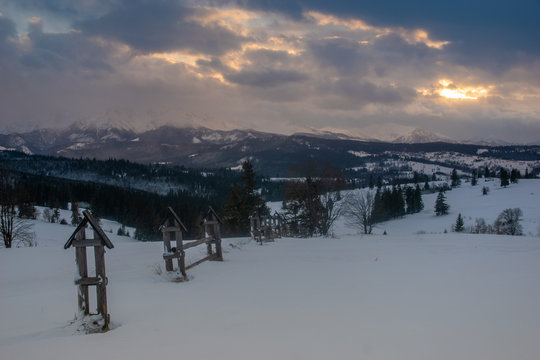 Beautiful snow clouds over the snow-covered peaks of the Tatra Mountains in the light of the setting sun © Mike Mareen