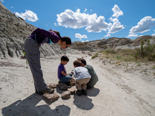 family exploring in Dinosaur Provincial Park Alberta Canada