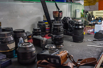 Many lens on table at cleaning camera service room