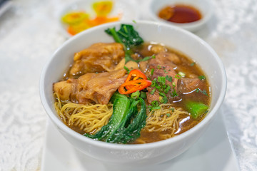 Delicious Chinese styled braised beef noodle soup on white background