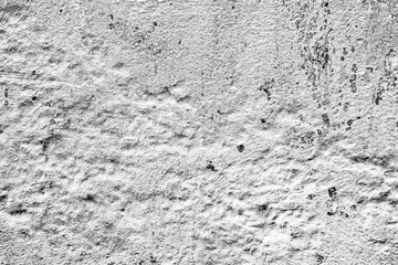 Texture of a concrete wall with cracks and scratches which can be used as a background