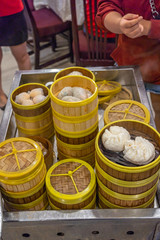 Assortment of steamed dumplings on dimsum cart in Chinese restaurant