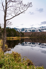 The Second Lake of Shiretoko Goko Five Lakes area. Rolling mountain range and woodland on springtime. High latitude country natural beauty scenery. Shiretoko National Park. Town Shari, Hokkaido, Japan