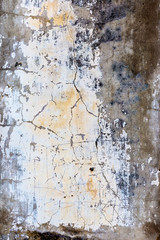 Grey cracked concrete wall. Cracked concrete wall covered with gray cement texture as background for design. Grunge cement wall with crack in industrial building,